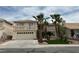 Two-story home with desert landscaping, balcony, and attached two-car garage at 3340 Shallow Pond Dr, Las Vegas, NV 89117