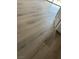 Close-up of the updated laminate flooring with view of the bottom of the doorframe at 3340 Shallow Pond Dr, Las Vegas, NV 89117
