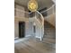 Staircase in the foyer with chandelier and stylish gray walls at 3340 Shallow Pond Dr, Las Vegas, NV 89117