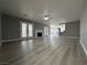 Open floor plan with kitchen, dining and living areas with fireplace at 3340 Shallow Pond Dr, Las Vegas, NV 89117