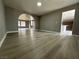 Open living room with neutral walls, hardwood flooring and arched entryway at 3340 Shallow Pond Dr, Las Vegas, NV 89117