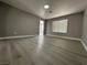 Open concept living room featuring modern flooring and neutral wall color at 3340 Shallow Pond Dr, Las Vegas, NV 89117