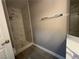Shower stall features elegant marble-style tile and modern fixtures at 3340 Shallow Pond Dr, Las Vegas, NV 89117