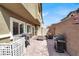 Private backyard patio with multiple grills, cozy seating, and a well-maintained brick surface, perfect for gatherings at 4625 Ridgeley Ave # 102, North Las Vegas, NV 89084