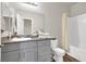 Bathroom featuring a gray vanity with granite counter and tub and shower combo at 4625 Ridgeley Ave # 102, North Las Vegas, NV 89084