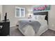 Bedroom featuring large window and artwork above headboard at 4625 Ridgeley Ave # 102, North Las Vegas, NV 89084