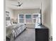 Cozy bedroom with natural light, plush bedding, and a ceiling fan, creating a tranquil retreat at 4625 Ridgeley Ave # 102, North Las Vegas, NV 89084
