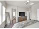 Spacious bedroom with a large mirror, a ceiling fan, and plenty of natural light, creating a relaxing atmosphere at 4625 Ridgeley Ave # 102, North Las Vegas, NV 89084