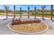 Community park entrance featuring palm trees and playground in a Primary-planned community at 4625 Ridgeley Ave # 102, North Las Vegas, NV 89084