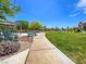 Picturesque community park featuring a walking path, seating, lush green lawn, and mature trees at 4625 Ridgeley Ave # 102, North Las Vegas, NV 89084