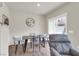 Dining area featuring a modern table set, a large window, and hardwood floors at 4625 Ridgeley Ave # 102, North Las Vegas, NV 89084