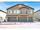 Two story townhome featuring a private balcony and three garages at 4625 Ridgeley Ave # 102, North Las Vegas, NV 89084