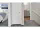 Hallway leads to bedroom and bathroom with gray vanity and granite counter at 4625 Ridgeley Ave # 102, North Las Vegas, NV 89084