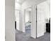 Upstairs hallway with multiple doors leading to bedrooms and office at 4625 Ridgeley Ave # 102, North Las Vegas, NV 89084