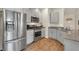 Well-equipped kitchen featuring stainless steel appliances, grey cabinetry and granite countertops at 4625 Ridgeley Ave # 102, North Las Vegas, NV 89084