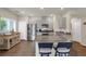 Modern kitchen featuring stainless steel appliances, granite countertops, and bar seating at 4625 Ridgeley Ave # 102, North Las Vegas, NV 89084