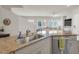 Open concept kitchen island with stainless steel sink and granite countertops at 4625 Ridgeley Ave # 102, North Las Vegas, NV 89084