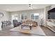 Bright living room featuring hardwood floors, large windows, and comfortable seating at 4625 Ridgeley Ave # 102, North Las Vegas, NV 89084