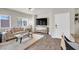 Cozy living room featuring hardwood floors, large windows, and comfortable furniture at 4625 Ridgeley Ave # 102, North Las Vegas, NV 89084