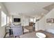 Open-concept living space featuring hardwood floors, a kitchen and dining area at 4625 Ridgeley Ave # 102, North Las Vegas, NV 89084