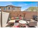Charming patio with cozy seating area, colorful accents, and a built-in grill, creating a perfect outdoor oasis at 4625 Ridgeley Ave # 102, North Las Vegas, NV 89084