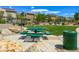 Charming community picnic area with green picnic tables and lush landscaping for outdoor enjoyment at 4625 Ridgeley Ave # 102, North Las Vegas, NV 89084
