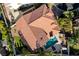 Stunning aerial view of a red-tiled roof home with a sparkling blue pool and lush landscaping at 4651 Munich Ct, Las Vegas, NV 89147