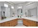 Bright bathroom featuring double sinks, white countertops, vanity, and updated fixtures at 4651 Munich Ct, Las Vegas, NV 89147