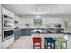 Spacious kitchen with granite countertops, modern appliances, and a breakfast bar at 4651 Munich Ct, Las Vegas, NV 89147
