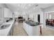 Well-lit kitchen boasts granite counters, stainless appliances, and connects to a dining area at 4651 Munich Ct, Las Vegas, NV 89147