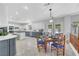 Bright, modern kitchen with sleek countertops, stainless steel appliances, and cozy breakfast nook at 4651 Munich Ct, Las Vegas, NV 89147