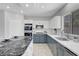 Lovely renovated kitchen featuring granite countertops and stainless steel appliances at 4651 Munich Ct, Las Vegas, NV 89147