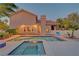Stunning backyard showcasing a sparkling pool and spa with a covered patio, perfect for outdoor relaxation and entertainment at 4651 Munich Ct, Las Vegas, NV 89147