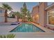 A sparkling pool with integrated spa and meticulously designed patio offers a private outdoor retreat at 4651 Munich Ct, Las Vegas, NV 89147