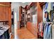 Spacious walk-in closet featuring custom wood shelving and drawers for ample storage at 4651 Munich Ct, Las Vegas, NV 89147