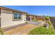 An outdoor space with a well-maintained patio, walkway, and landscaping at 4820 Se Clifftop Dr, Pahrump, NV 89061