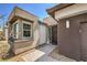 Inviting front entrance with decorative wreath, stone walkway, and manicured landscaping at 4820 Se Clifftop Dr, Pahrump, NV 89061