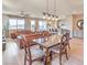 Open-concept living space with hardwood floors, kitchen island, and dining area for seamless entertaining at 4820 Se Clifftop Dr, Pahrump, NV 89061
