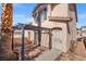 Enclosed backyard with stone tile patio and pergola, perfect for outdoor entertaining at 51 Belle Point Ave, Las Vegas, NV 89123