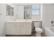 Bright bathroom featuring a double sink vanity, white cabinets, and modern fixtures at 51 Belle Point Ave, Las Vegas, NV 89123