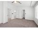 Large bedroom with carpet, ceiling fan, closet, and easy access to bathroom at 51 Belle Point Ave, Las Vegas, NV 89123