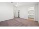 Large bedroom with ceiling fan, closet, and bathroom access provides ample living space at 51 Belle Point Ave, Las Vegas, NV 89123