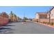A secure gated entrance with a guardhouse and well-maintained landscaping at 51 Belle Point Ave, Las Vegas, NV 89123