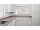 Bright kitchen featuring white cabinetry and durable countertops, ready for culinary adventures at 51 Belle Point Ave, Las Vegas, NV 89123