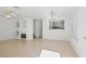 Bright living room with tile flooring, a decorative fireplace, and neutral decor at 51 Belle Point Ave, Las Vegas, NV 89123