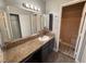 Bathroom featuring granite countertop, mirror, cabinet, and walk-in shower at 5150 S Jones Blvd # 105, Las Vegas, NV 89118