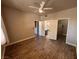 Bedroom featuring wood-look flooring, a ceiling fan, and access to closet and bathroom at 5150 S Jones Blvd # 105, Las Vegas, NV 89118