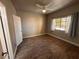 Bedroom featuring wood-look flooring, a ceiling fan, and bright natural light from the window at 5150 S Jones Blvd # 105, Las Vegas, NV 89118