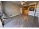 Open living room showcasing wood flooring, neutral walls, and natural lighting at 5150 S Jones Blvd # 105, Las Vegas, NV 89118