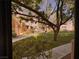 Community view through a window, showcasing lush landscaping and well-maintained surroundings at 5150 S Jones Blvd # 105, Las Vegas, NV 89118